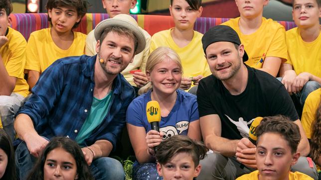 Bei der KiKA-Serie "Dein großer Tag" hat Amadei einen großen Kindertraum erfüllt und die Schülerin Charlotte in Parkour trainiert. Die beiden sind bei Johannes im Tigerenten Club.